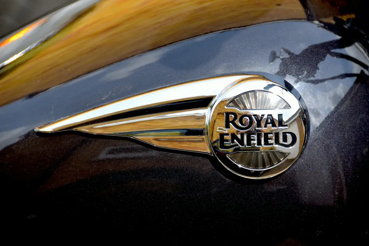 A close up of the royal enfield logo on a motorcycle